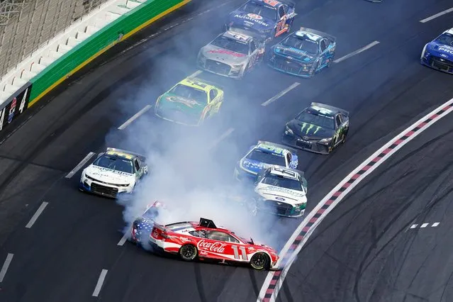 NASCAR Cup Series drivers Denny Hamlin (11) and Ross Chastain (1) crash during a NASCAR Cup Series auto race at Atlanta Motor Speedway, Sunday, July 10, 2022, in Hampton, Ga. (Photo by Bob Andres/AP Photo)