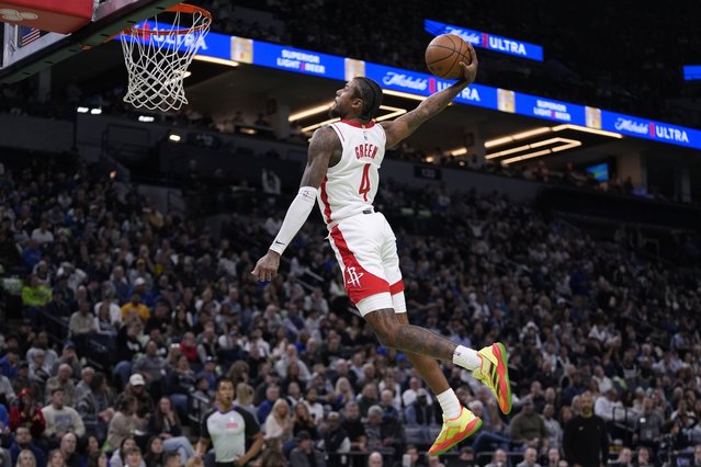 Houston Rockets guard Jalen Green goes up for a dunk during the second half of an Emirates NBA cup basketball game against the Minnesota Timberwolves, Tuesday, November 26, 2024, in Minneapolis. (Photo by Abbie Parr/AP Photo)