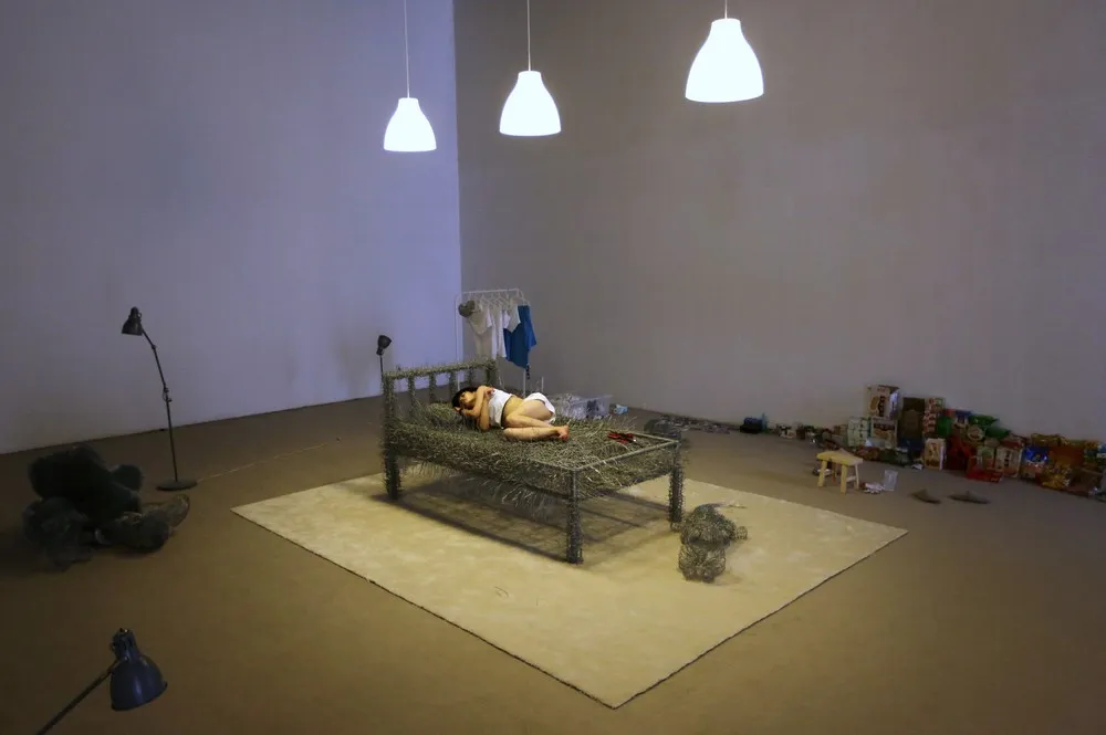 Chinese Artist Sleeps on a Iron Wire Bed
