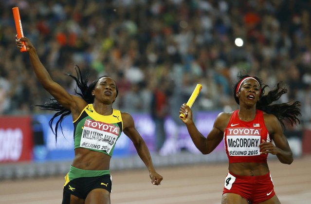 Novlene Williams-Mills of Jamiaca (L) and Francena McCorory of the U.S. compete as they cross the finish line in the women's 4 x 400 metres relay final during the 15th IAAF World Championships at the National Stadium in Beijing, China August 30, 2015. (Photo by Damir Sagolj/Reuters)