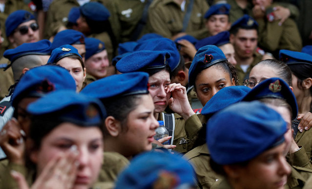 Israeli military members react during the funeral of Israeli soldier Avraham Fetena, who died from wounds sustained during Israel's ongoing ground operation in Gaza, in Haifa, Israel on November 17, 2023. (Photo by Shir Torem/Reuters)