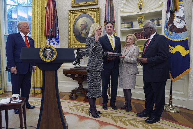 Pam Bondi is sworn in as Attorney General by Supreme Court Associate Justice Clarence Thomas, right, as President Donald Trump, partner John Wakefield and mother Patsy Bondi, look on, in the Oval Office of the White House, Wednesday, February 5, 2025, in Washington. (Photo by Evan Vucci/AP Photo)