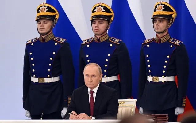 Russian President Vladimir Putin attends a ceremony to sign the treaties for four Donetsk and Luhansk regions of Ukraine to join Russia in the Kremlin in Moscow, Russia, Friday, September 30, 2022. (Photo by Grigory Sysoyev, Sputnik, Kremlin Pool Photo via AP Photo)