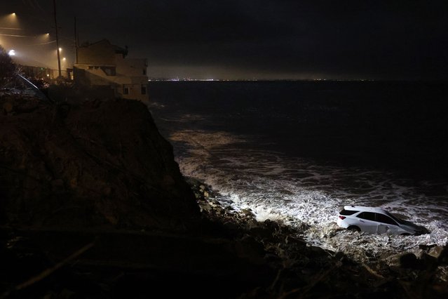 A partly submerged vehicle that was swept away by a mudslide after heavy rain in Pacific Palisades, California, US on February 13, 2025. (Photo by Chelsea Lauren/Rex Features/Shutterstock)