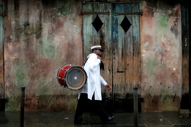 A musician walks in the French Quarter as Hurricane Nate approaches the U.S. Gulf Coast in New Orleans, Louisiana, U.S. October 7, 2017. (Photo by Jonathan Bachman/Reuters)