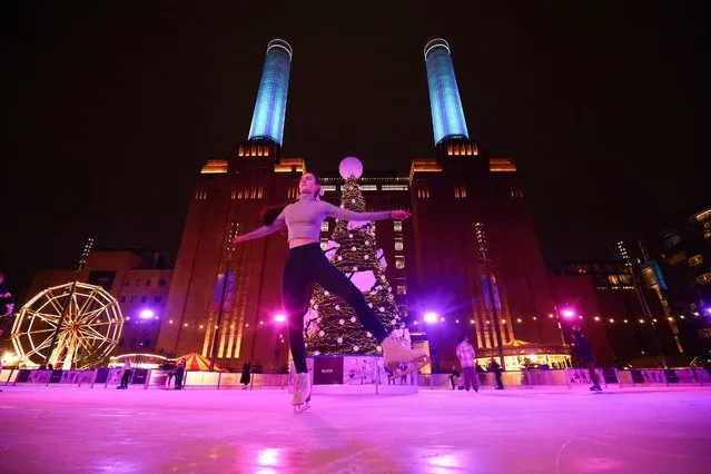 A person ice skates on the “Glide at Battersea Power Station” ice rink outside the newly refurbished Battersea Power Station in London, Britain on November 14, 2022. (Photo by Henry Nicholls/Reuters)