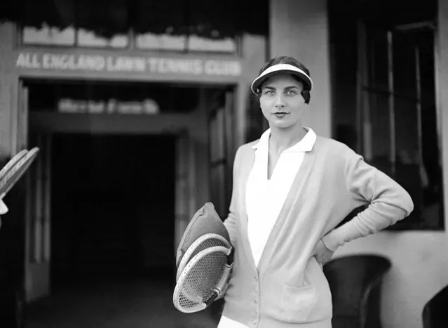 American tennis player Helen Wills Moody arriving at the Wimbledon Courts with spare rackets, to prepare for the Wightman Cup Championships at Wimbledon, London, England on June 6, 1930. (Photo by AP Photo)