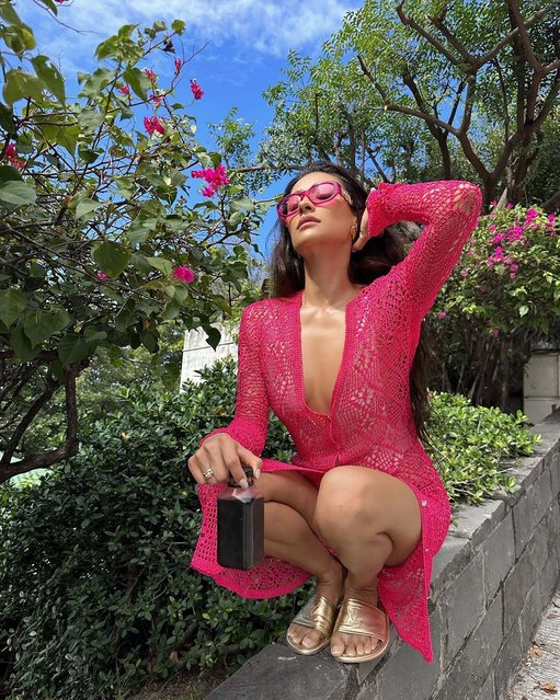 Canadian actress and model Shannon Ashley Garcia “Shay” Mitchell early January 2023 discovers flowers that complement her dress. (Photo by shaymitchell/Instagram)