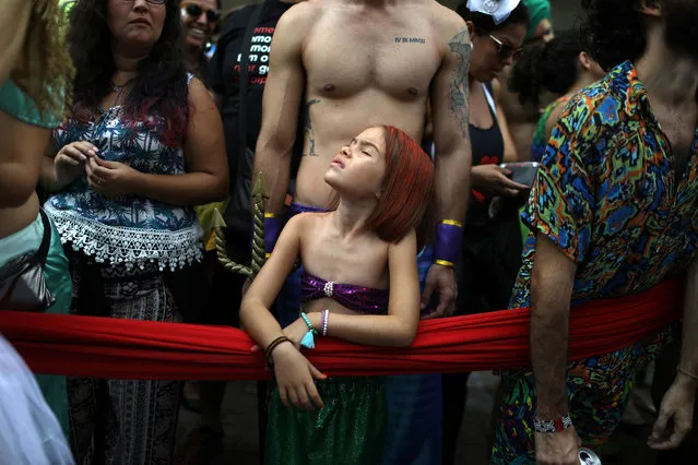 Revellers take part in the annual block party known as “Cordao do Boitata”, during carnival festivities in Rio de Janeiro, Brazil February 4, 2018. (Photo by Pilar Olivares/Reuters)