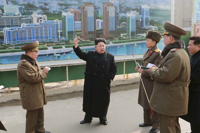 North Korean leader Kim Jong Un (C) issues instructions while visiting the construction site of the Mirae Scientists Street in Pyongyang in this undated photo released by North Korea's Korean Central News Agency (KCNA) in Pyongyang February 15, 2015. (Photo by Reuters/KCNA)