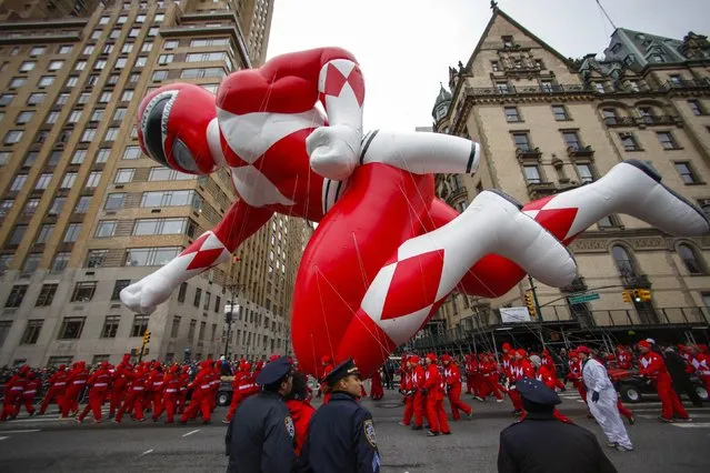 The red Mighty Morphin Power Ranger floats down Central Park West during the 88th Macy's Thanksgiving Day Parade in New York November 27, 2014. (Photo by Eduardo Munoz/Reuters)
