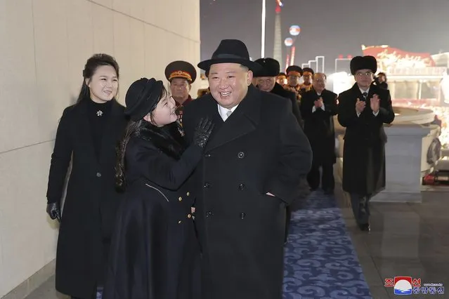 In this photo provided by the North Korean government, North Korean leader Kim Jong Un, front right, with his daughter and his wife Ri Sol Ju, left, attend a military parade to mark the 75th founding anniversary of the Korean People’s Army on Kim Il Sung Square in Pyongyang, North Korea Wednesday, February 8, 2023. (Photo by Korean Central News Agency/Korea News Service via AP Photo)