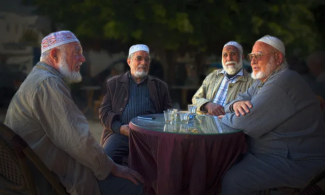 “I took this picture one morning at a cafe in Monastir, Tunisia. These four gentlemen were talking at the next table and I asked them if they would mind having their photo taken. They were quite agreeable to carrying on their conversation while I took the picture”. (Photo by Alex Dawson/The Guardian)