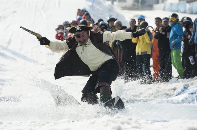A man dressed as a pirate skis during the Naked Pig Skiing Carnival at the Yabuli Ski Resort on March 24, 2018 in Harbin of Heilongjiang Province, northeast China. (Photo by Tao Zhang/Getty Images)
