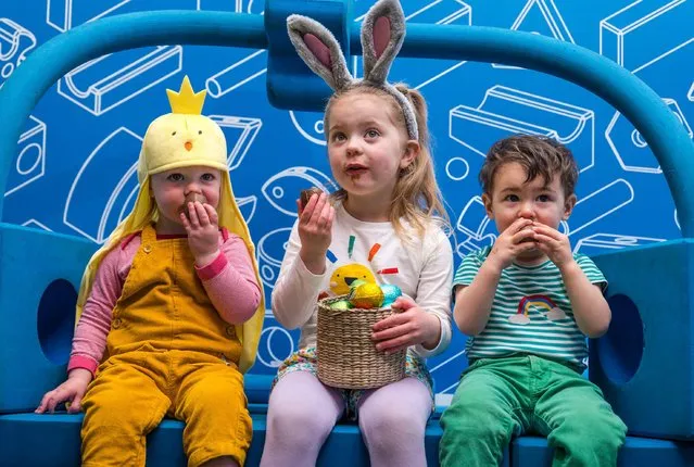 Children get ready for Easter by rolling colourful Easter eggs down a slide constructed from building blocks from the Imagination Playground installation at City Art Centre in Edinburgh, Scotland on April 5, 2023. (Photo by Sally Anderson/Alamy Live News)