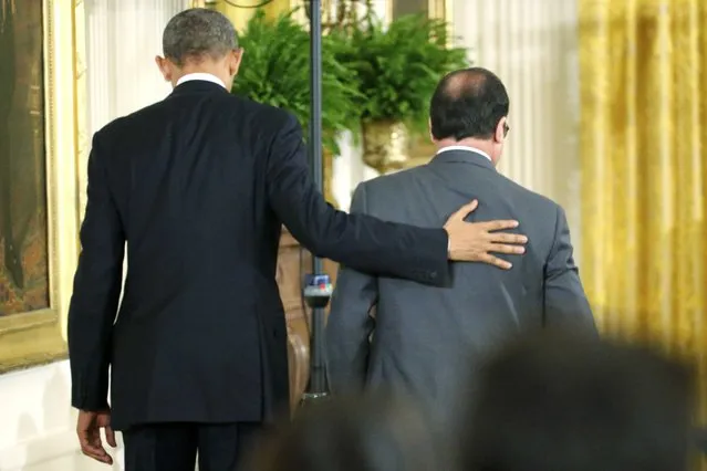 U.S. President Barack Obama (L) and French President Francois Hollande depart after a joint news conference in the East Room of the White House in Washington November 24, 2015. (Photo by Jonathan Ernst/Reuters)