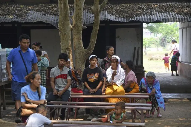 Refugees from Manipur state rest at a relief camp at Lakhipur, in the northeastern Indian state of Assam, Sunday, May 7, 2023. Security measures are keeping the peace in the neighbouring state of Manipur where 60 people were killed and 35,000 civilians were displaced in rioting and ethnic clashes last week, officials said. (Photo by Panna Ghosh/AP Photo)