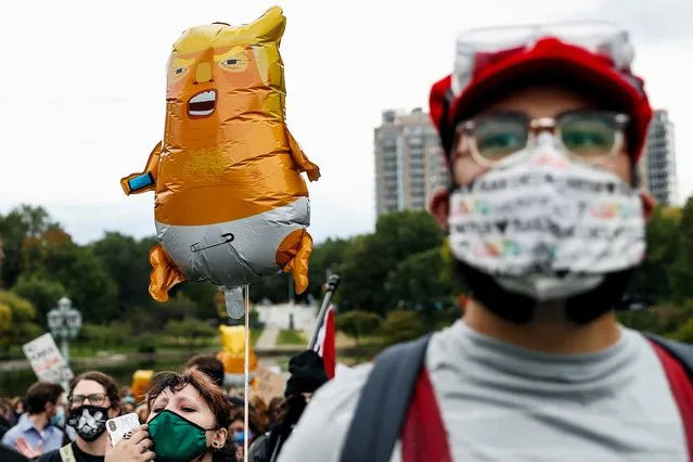 Protestors demonstrate near the venue of the first 2020 presidential campaign debate between U.S. President Donald Trump and Democratic presidential nominee Joe Biden in Cleveland, Ohio, U.S., September 29, 2020. (Photo by Shannon Stapleton/Reuters)