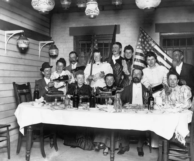 A party in a middle class home. Plenty of drinks in evidence. The flags point to a 4th of July celebration, 1894. (Photo by Bettmann Archive/Getty Images)