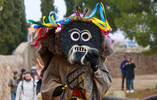 A man dressed as a Zagarron character visits the villagers houses to congratulate them with the New Year and ask for a Christmas bonus in the village of Montamarta in Zamora, northern Spain, 01 January 2025. (Photo by Mariam A. Montesinos/EPA/EFE)