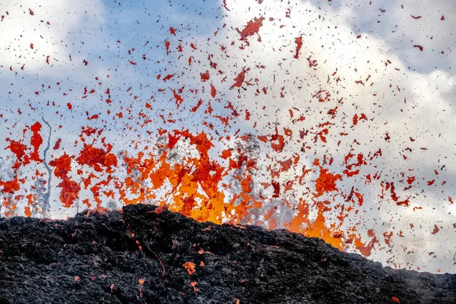 These beautiful images aim to show the more artistic side of Hawaii’s recent volcano eruption, highlighting the sheer power of Mother Nature and the act of creating new land. Photographer CJ Kale’s breathtaking works show the molten lava in its incredible vibrancy, whether it’s bursting from the ground in fireworks fashion or pouring into surrounding waters, causing steam to rise. CJ, 41, who is from Hawaii, said: “I have chosen to show the beauty of the volcano and try to convey that even though this is a destructive event, it is a beautiful event”. (Photo by CJ Kale/Caters News Agency)