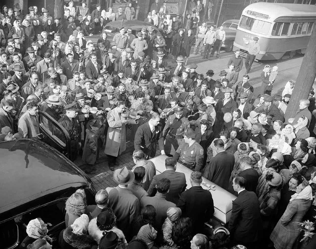 A group of Gypsy violinists play the unwritten dirge “I Am Leaving You Forever” give Andrew Margitza, also a Gypsy violinist, the final serenade he wanted as his body is borne from St. Michael's Roman Catholic Church in Pittsburgh, Penn., October 21, 1948. (Photo by AP Photo)