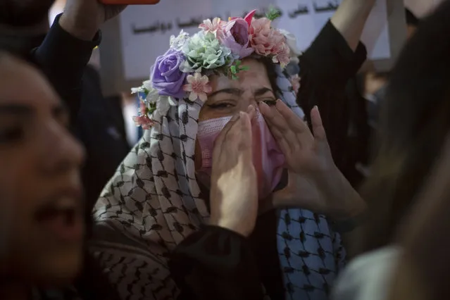 Palestinians chant slogans during a protest against the forcible eviction of Palestinians from their homes in the Sheikh Jarrah neighborhood of east Jerusalem, in the West Bank city of Ramallah, Sunday, May 9, 2021. (Photo by Majdi Mohammed/AP Photo)