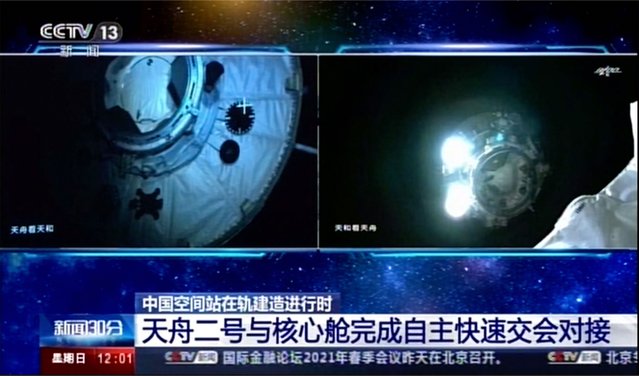 This image made from video footage by China's CCTV shows Tianhe core module's camera footage showing Tianzhou 2 cargo spacecraft approaching on Sunday, May 30, 2021. An automated spacecraft docked with China's new space station Sunday carrying fuel and supplies for its future crew, the Chinese space agency announced. (Photo by CCTV via AP Video)