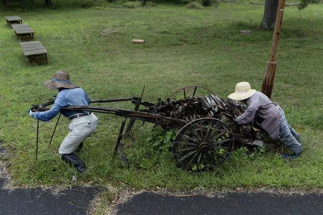 Handmade human-sized scarecrows pull a firewood cart to illustrate the old Japanese countryside life in the village of “Kakasi No Sato” on September 20, 2023 in Yasutomi, Japan. (Photo by Buddhika Weerasinghe/Getty Images)