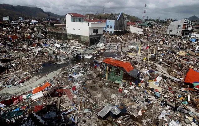 Thousands of homes are destroyed after super Typhoon Haiyan battered Tacloban city. One of the most powerful storms ever recorded killed at least 10,000 people in the central Philippines, with huge waves sweeping away entire coastal villages and devastating the region's main city. The storm destroyed about 70 to 80 percent of the area in its path as it tore through Leyte province on Friday. (Photo by Romeo Ranoco/Reuters)