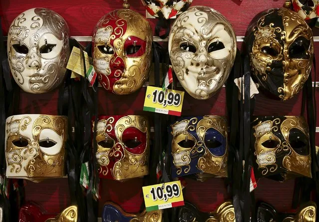Carnival masks hang on the wall of the shop near St. Mark's Square during the Venice Carnival, January 31, 2016. (Photo by Alessandro Bianchi/Reuters)