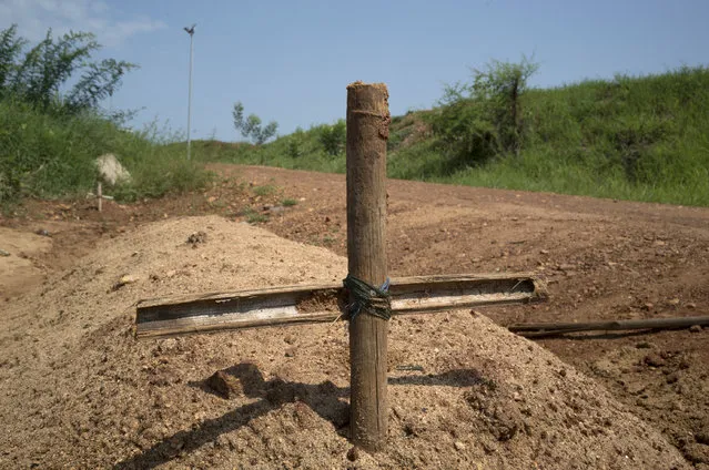 SOUTH SUDAN: Graves of unidentified people killed during recent fighting are seen in Juba, South Sudan, July 22, 2016. (Photo by Adriane Ohanesian/Reuters)