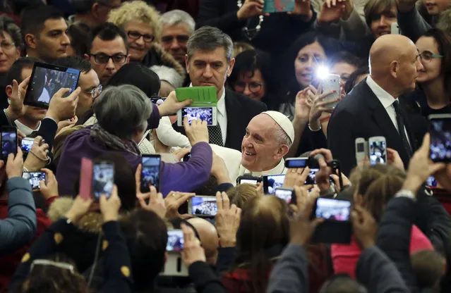 Pope Francis arrives for an audience with residents of the areas of central Italy hit by earthquakes, in the Pope Paul IV hall, at the Vatican, Thursday, January 5, 2017. Two strong earthquakes hit central Italy last August and October 2016 causing some 300 victims and leaving thousands homeless. (Photo by Andrew Medichini/AP Photo)