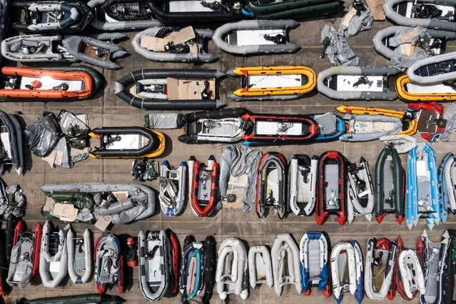 Inflatable dinghies used by migrants to cross the channel from France are stored in a compound on June 11, 2021 in Dover, England. More than 500 migrants arrived in the final week of May, according to the UK Home Office, adding that 3,600 people had been stopped from crossing the channel by French authorities. (Photo by Dan Kitwood/Getty Images)