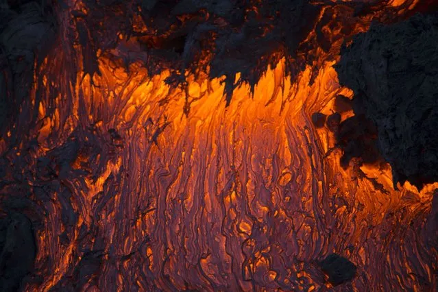 The molten lava from the Plosky Tolbachik volcano. (Photo by Denis Budkov/Caters News)