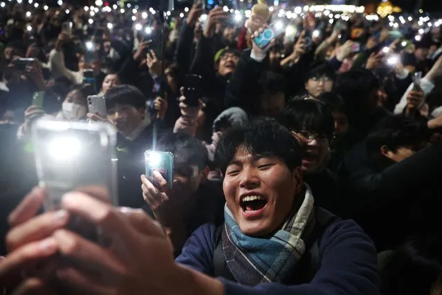 People attend a ceremony to celebrate the new year in Seoul, South Korea on December 31, 2023. (Photo by Kim Hong-Ji/Reuters)