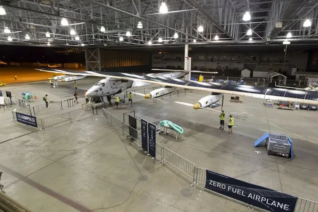The Solar Impulse 2 airplane is prepared to be moved from its hangar before a test flight from Kalaealoa Airfield in Kapolei, Hawaii, March 3, 2016. (Photo by Eugene Tanner/Reuters)