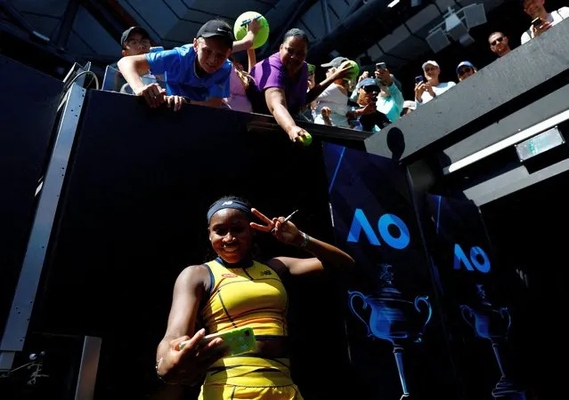 Coco Gauff of the U.S. takes a selfie with fans after winning her second round match against Caroline Dolehide of the U.S. at the Australian Open in Melbourne on January 17, 2024. (Photo by Issei Kato/Reuters)