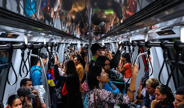 Passengers on the Metro, which has resumed operation after a major power outage in Caracas, Venezuela on March 15, 2019. (Photo by TASS/Barcroft Images)