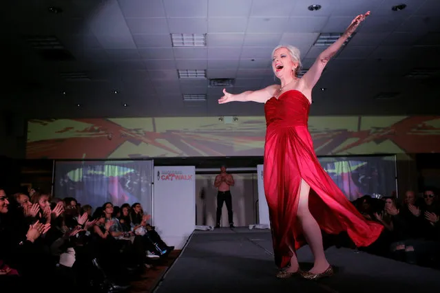 Cancer patient Lisa Layton of Portland in Oregon, part of a group of advanced-stage cancer patients modeling in the SMGlobal Catwalk presentation for Say Yes to HOPE, walks the runway during New York Fashion Week in Manhattan, New York, U.S., February 11, 2017. (Photo by Andrew Kelly/Reuters)