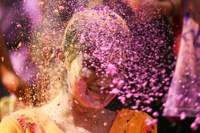 A girl is smeared with ‘Gulal' as she celebrates Holi, the Hindu spring festival of colours, in Chennai on March 25, 2024. (Photo by R.Satish Babu/AFP Photo)