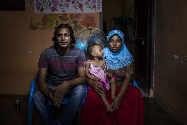 A Rohingya refugee family Khairul (27) and his wife Sajidah Bibi (25) with their daughter, pose for photograph inside of their refugee camp on February 11, 2017 in Medan, North Sumatra, Indonesia. Khairul, have been in refugee camp for six years and are not able to legally work while waiting for registration and resettlement. (Photo by Ulet Ifansasti/Getty Images)