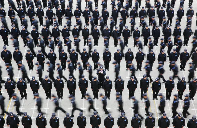 Police officers of the China Immigration Inspection take part in a training session in Shenyang, Liaoning province, China on May 20, 2019. (Photo by Reuters/China Stringer Network)