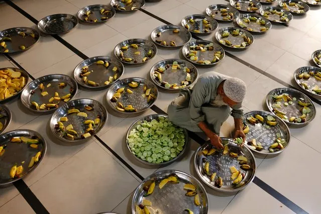 A muslim prepares iftar before breaking the fast during the first day of Ramadan in Dhaka, Bangladesh on March 12, 2024. (Photo by Mohammad Ponir Hossain/Reuters)