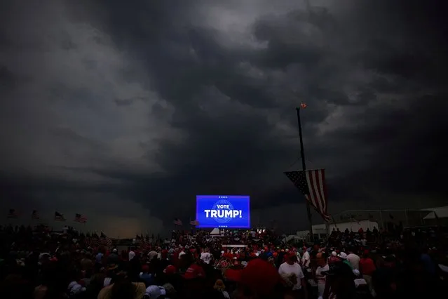 Storm clouds hang over a campaign rally for Republican presidential candidate and former U.S. President Donald Trump, shortly before the event was postponed, in Wilmington, North Carolina, on April 20, 2024. (Photo by Brian Snyder/Reuters)
