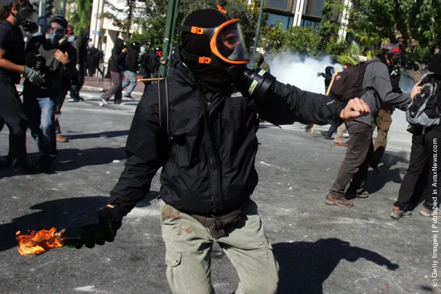 Demonstrators clashes with police during a protest against plans for new austerity measures in Athens, Greece