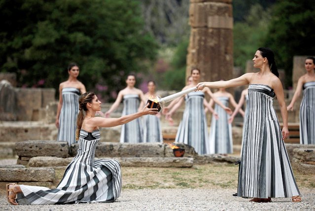 Greek actress Mary Mina, playing the role of High Priestess, lights the flame during the Olympic Flame lighting ceremony for the Paris 2024 Olympics in Ancient Olympia, Greece, on April 16, 2024. (Photo by Alkis Konstantinidis/Reuters)