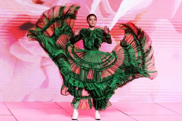 A model presents a creation from the “Remembranzas y Colores” collection by Mexican designer Carlos Pineda with textures and prints honouring Mexico, during the first day of the 76th edition of Intermoda in Guadalajara, state of Jalisco, Mexico, on January 18, 2022. (Photo by Ulises Ruiz/AFP Photo)