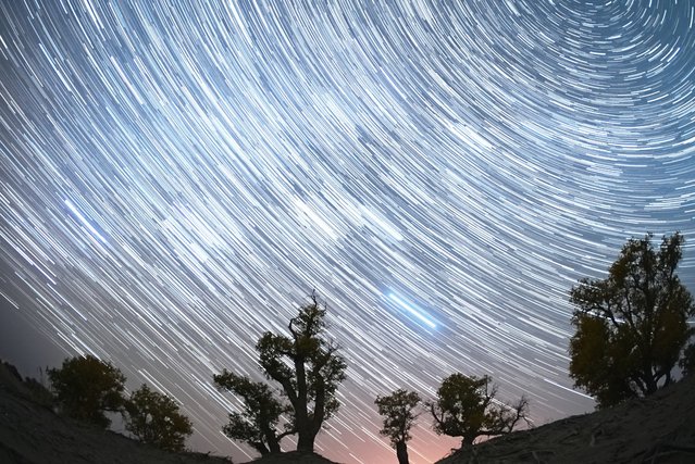 Orionid meteor shower lights up the night sky over a desert on October 22, 2023 in Yuli County, Bayingolin Mongol Autonomous Prefecture, Xinjiang Uygur Autonomous Region of China. (Photo by VCG/VCG via Getty Images)