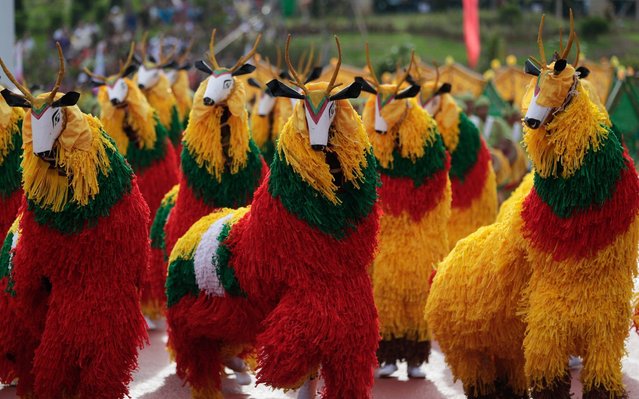 Dancers perform Toe Naya dance (the dance of the yak) during the celebration to mark the 30th anniversary of Eastern Shan State Special Region 4, at border city Mong La, Eastern Shan State, Myanmar, 30 June 2019. Shan State Special region 4 (also called Mong La autonomous region) celebrates its 30th anniversary celebrations in Mong La, one of the major cities in Golden Triangle Region which was built from a small village to become Myanmar's capital of gambling. (Photo by Lynn Bo Bo/EPA/EFE/Rex Features/Shutterstock)